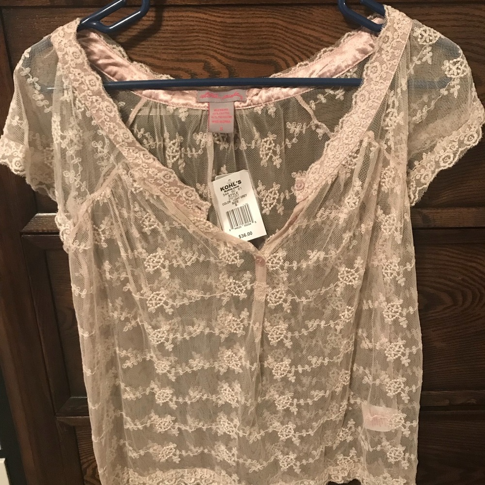 See-through cream colored blouse